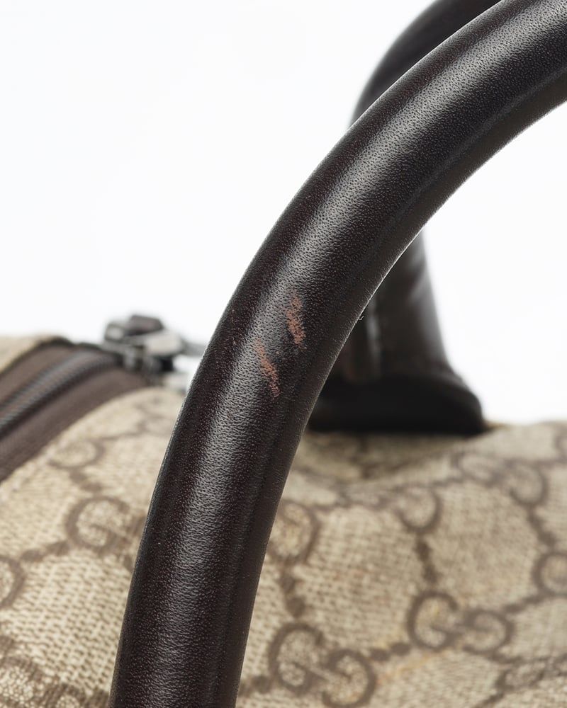 Gucci   |    Supreme Crossbody Bag