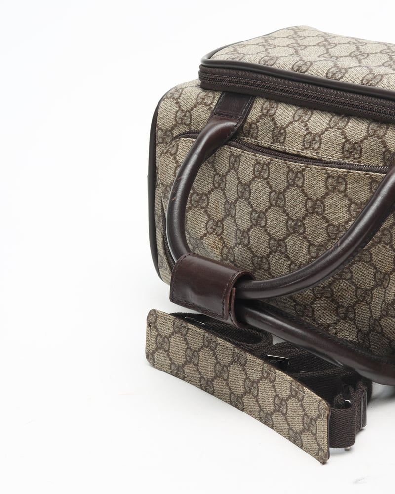 Gucci   |    Supreme Crossbody Bag