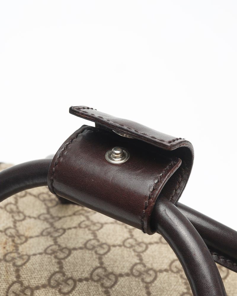 Gucci   |    Supreme Crossbody Bag