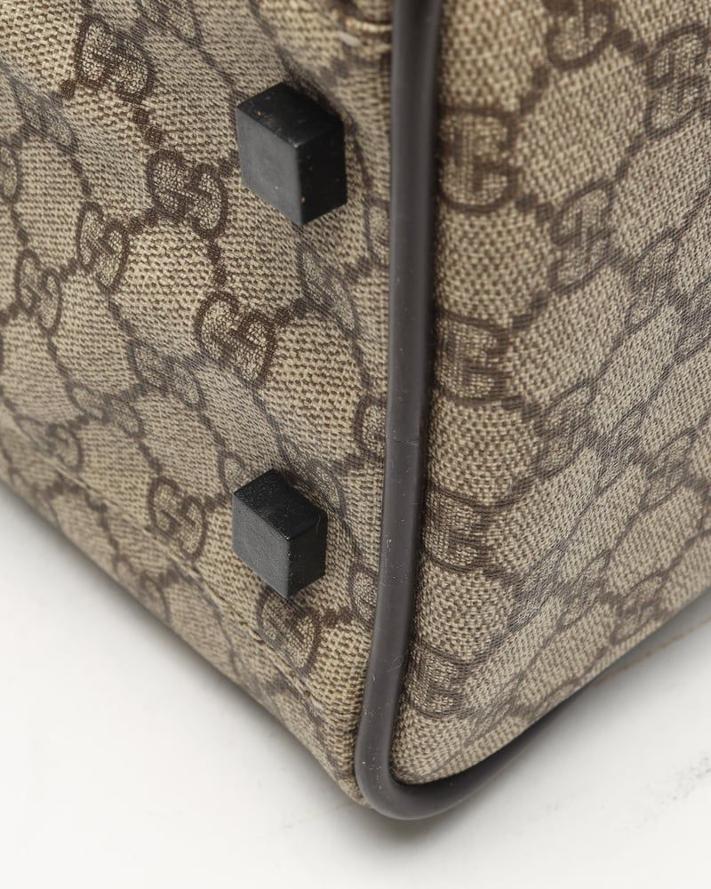 Gucci   |    Supreme Crossbody Bag